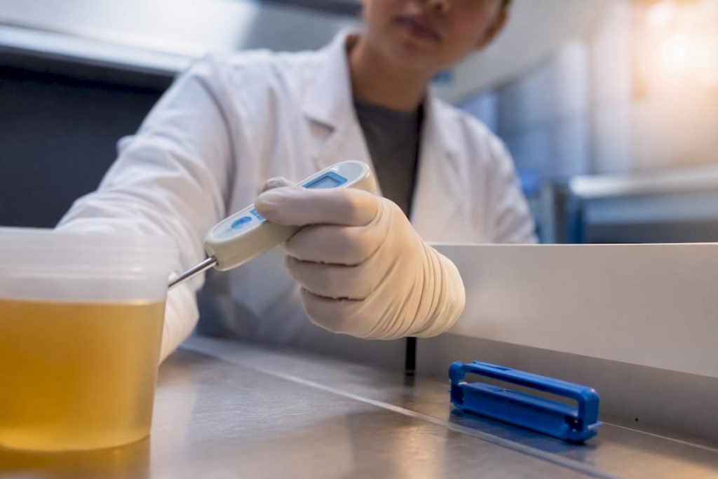 Technician checking specimen temperature